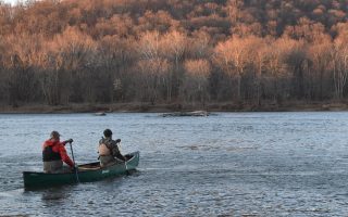 Two men rowing a canoe in Point of Rocks, Md.