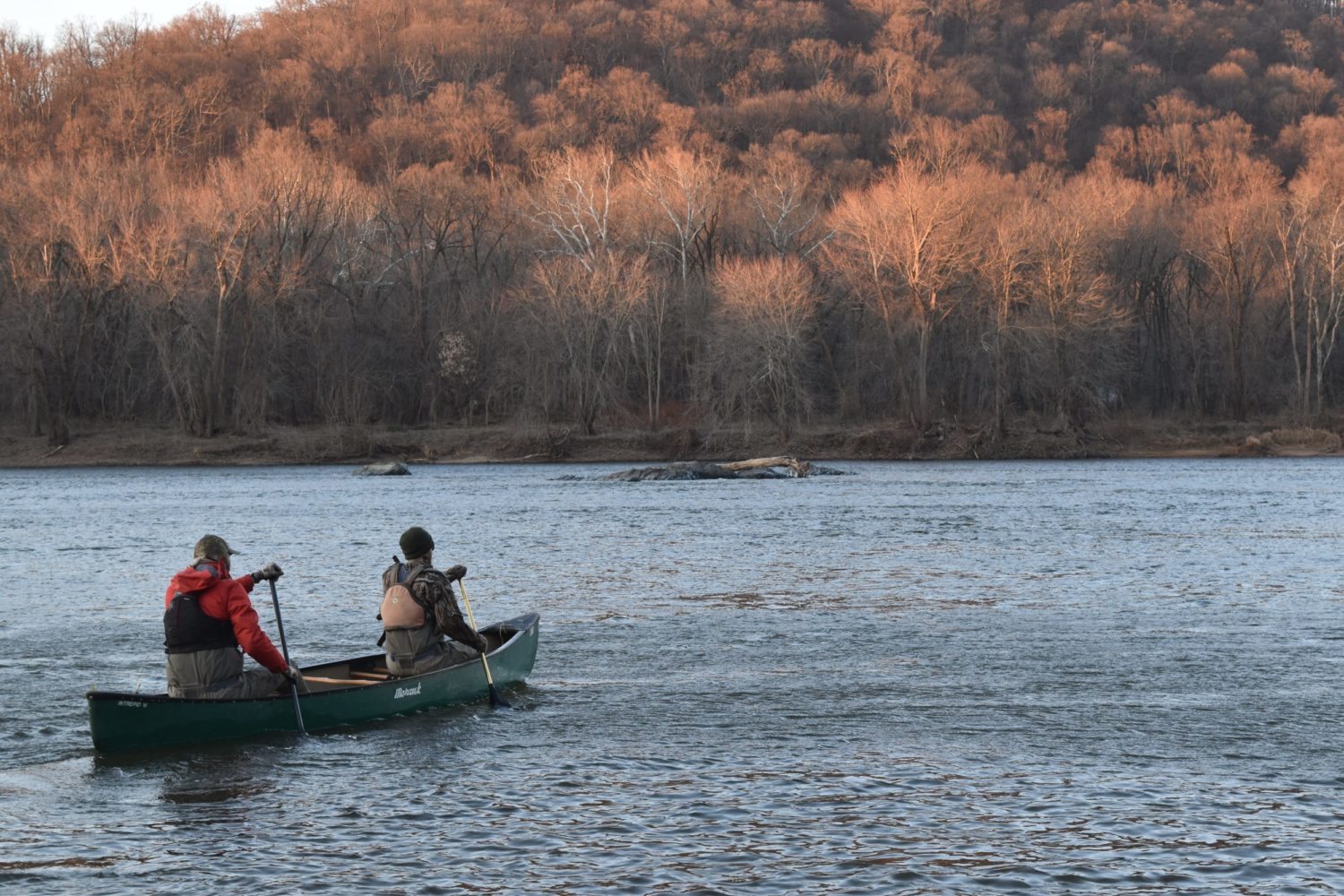 Two men rowing a canoe in Point of Rocks, Md.