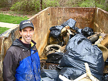 A volunteer with trash that they picked up.
