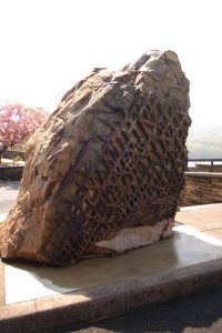A large rock with a waffle-like pattern on one side. Photo Credit: mdmarkus66, https://flic.kr/p/7WFfUy