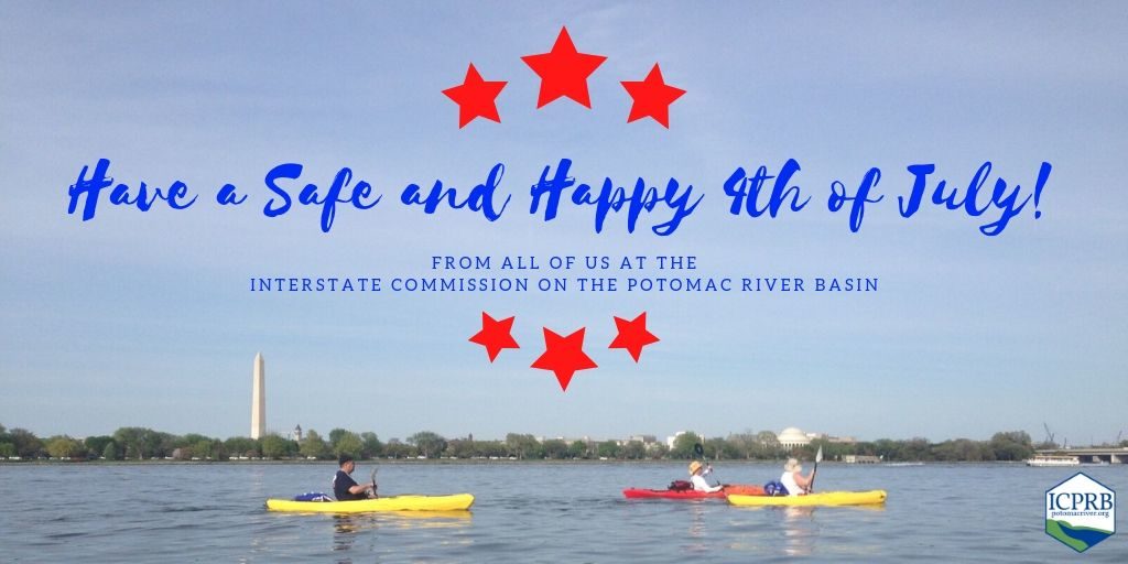 Kayakers paddle the Potomac River in front of the Washington Monument. 