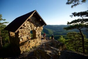 Rock building with a view of the mountains in the background. 