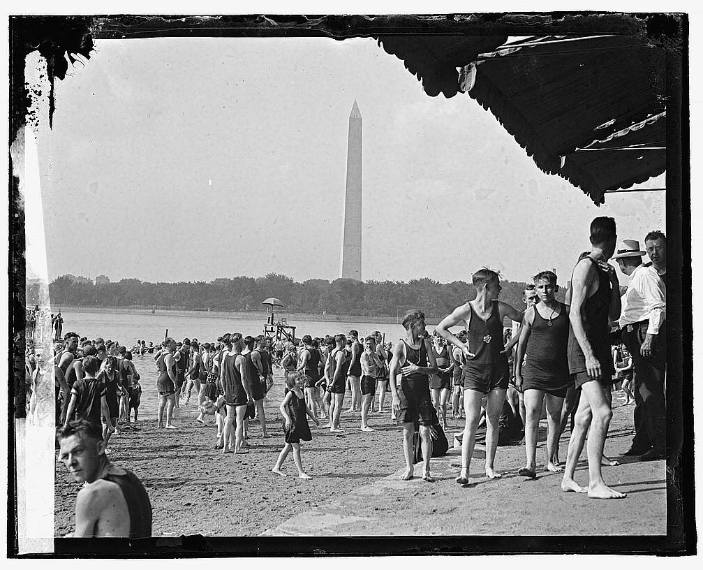 Swimmers enjoy the beach along the tidal basin / Potomac River.