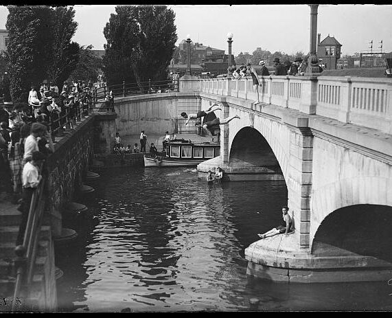 Swimmers jump off a bridge into the Potomac River in Washington, D.C.