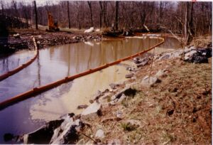 Booms capturing oil along Sugarland run. 